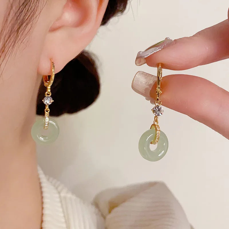 Magnifiques boucles d'oreilles clip paix plaquées or (Benin)